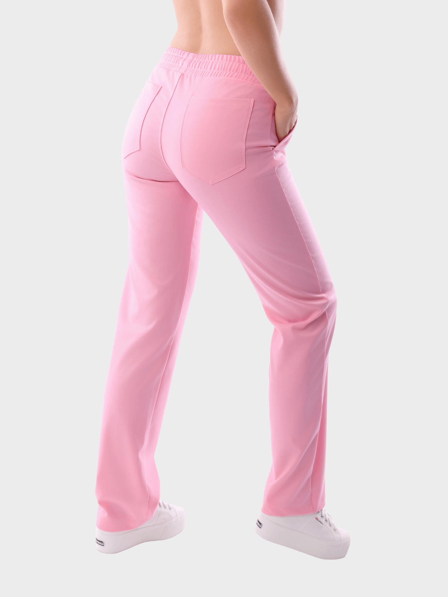 Stylish pink premium scrub pants for women, breathable and flexible medical workwear for clinics, hospitals, and beauty salons.