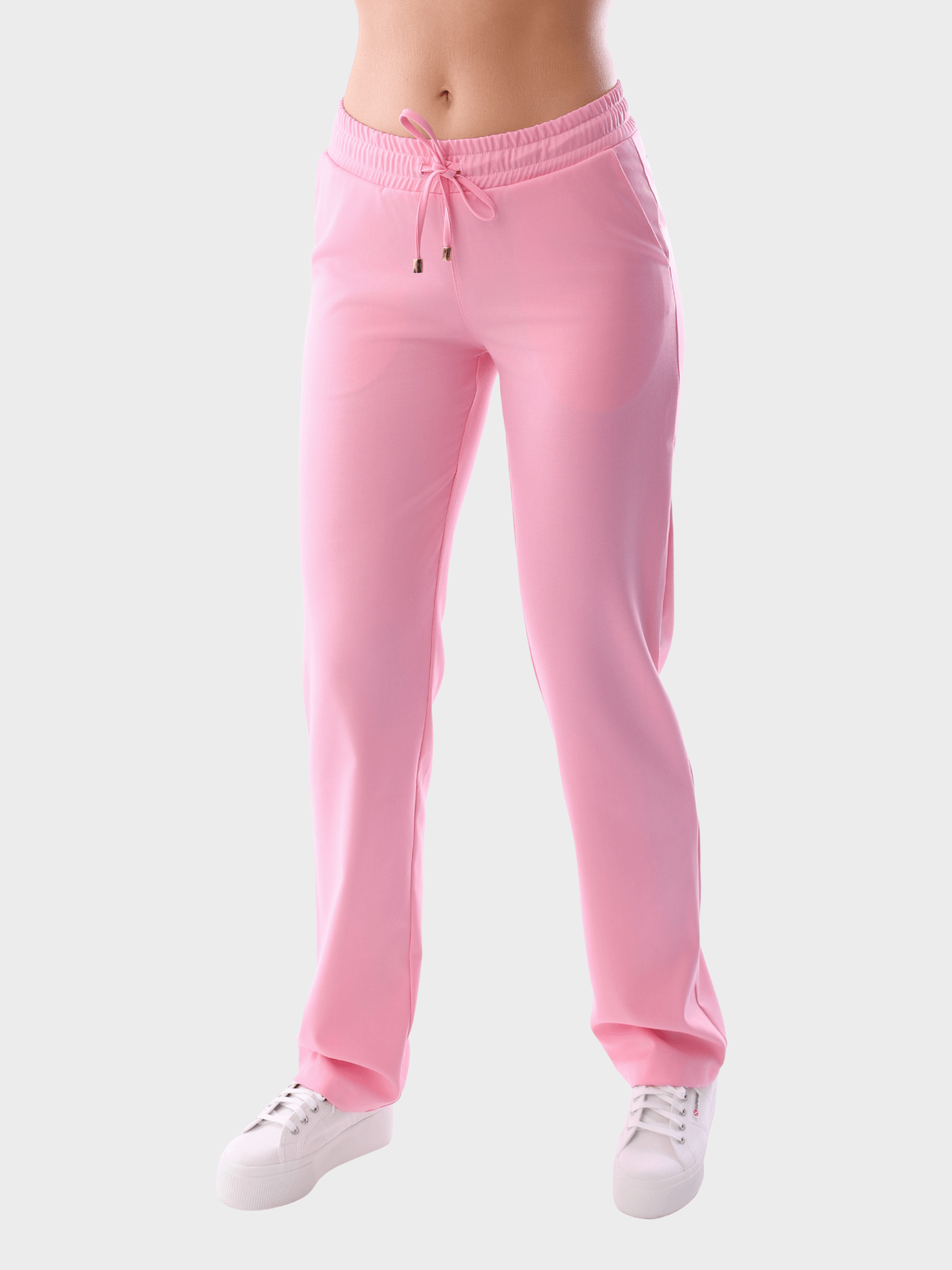 Elegant women’s medical scrub trousers in soft pink, premium quality professional uniform for healthcare and wellness staff.